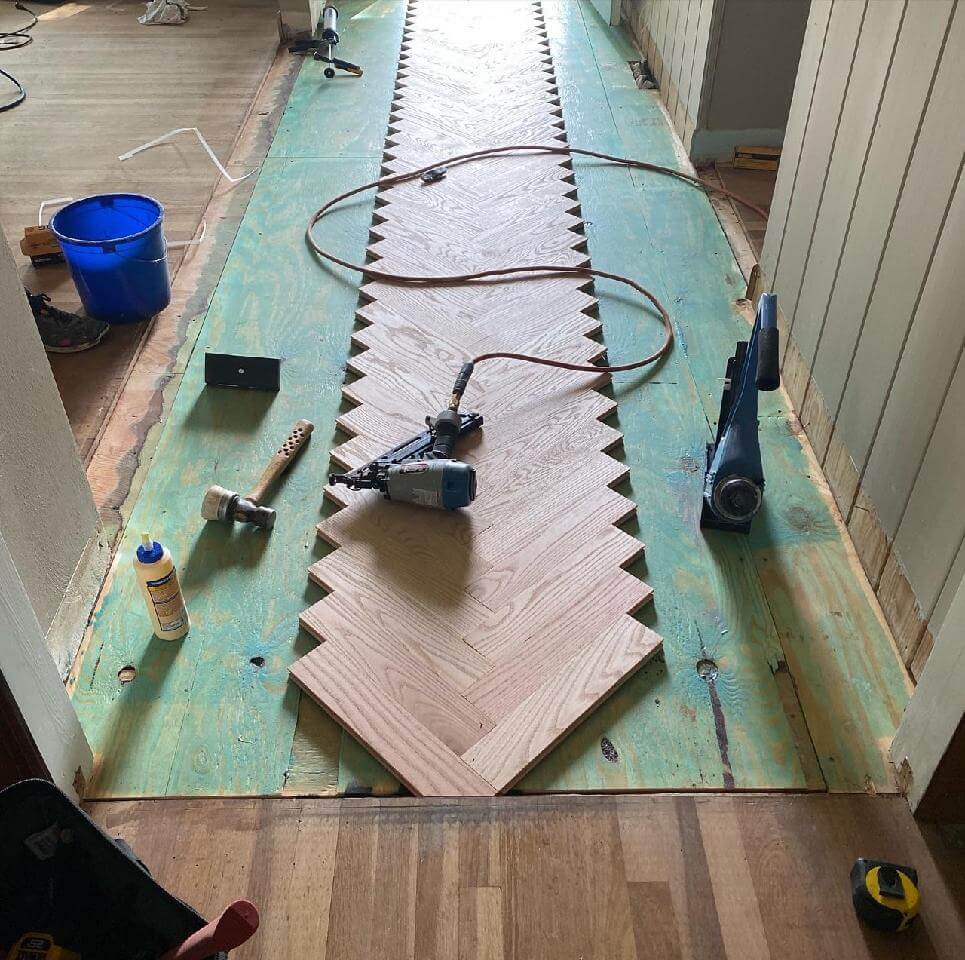 Herringbone floor install in progress