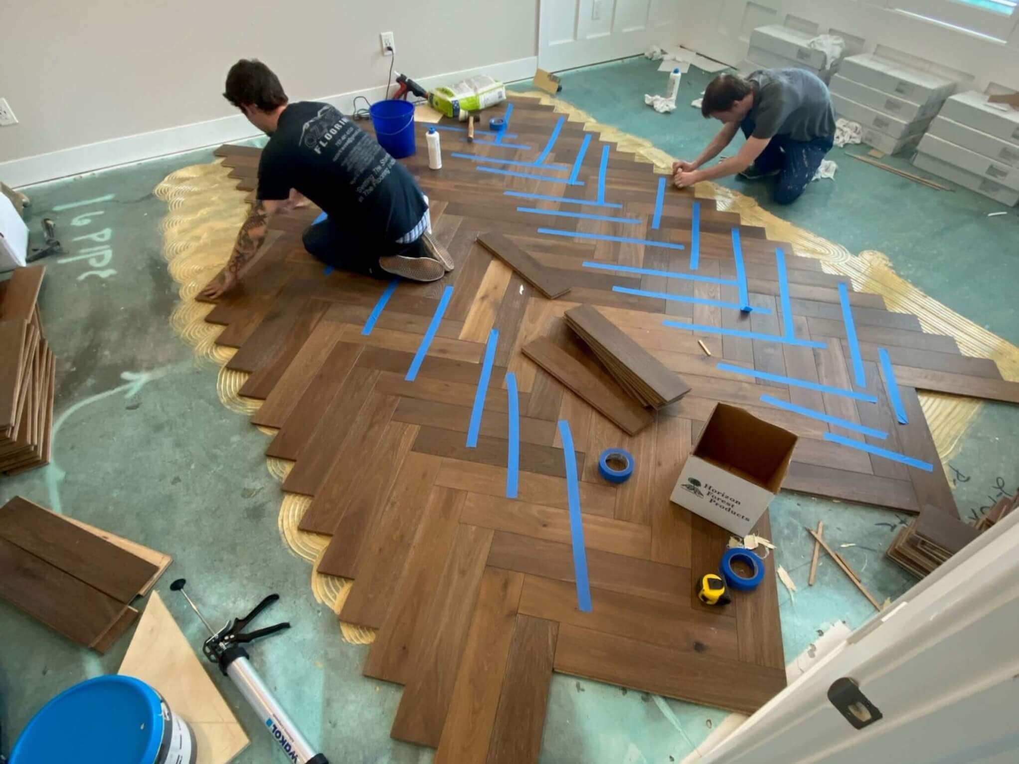 Herringbone floor install in progress